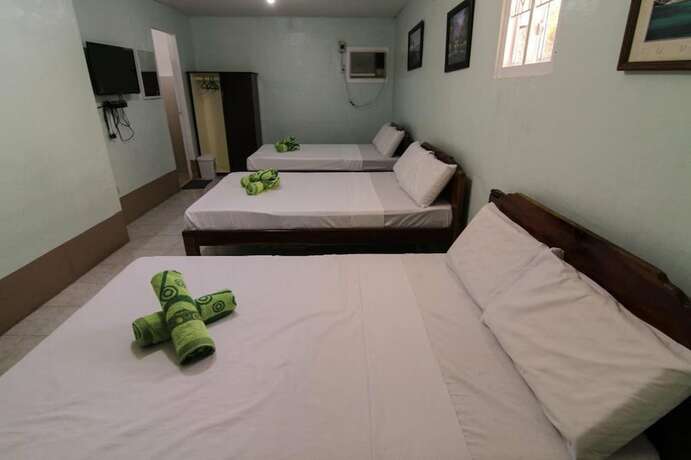 Imagen de la habitación del Hotel Villa Agatona Garden Resort. Foto 11