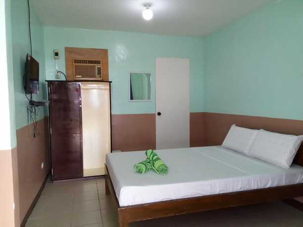 Imagen de la habitación del Hotel Villa Agatona Garden Resort. Foto 13