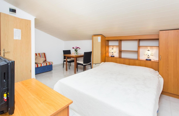 Imagen de la habitación del Hotel Villa Babilon. Foto 9