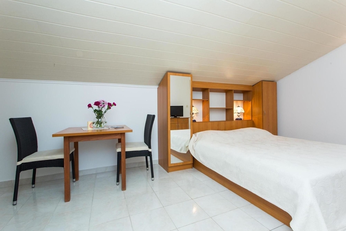 Imagen de la habitación del Hotel Villa Babilon. Foto 10