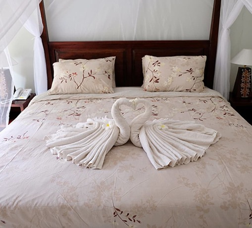 Imagen de la habitación del Hotel Villa Bau Nyale. Foto 21