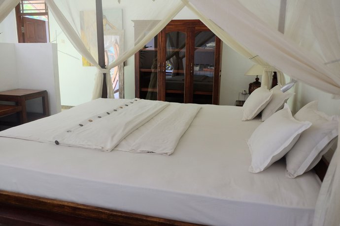 Imagen de la habitación del Hotel Villa Boreh Beach Resort and Spa. Foto 14