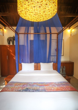Imagen de la habitación del Hotel Villa Borobudur Resort. Foto 19
