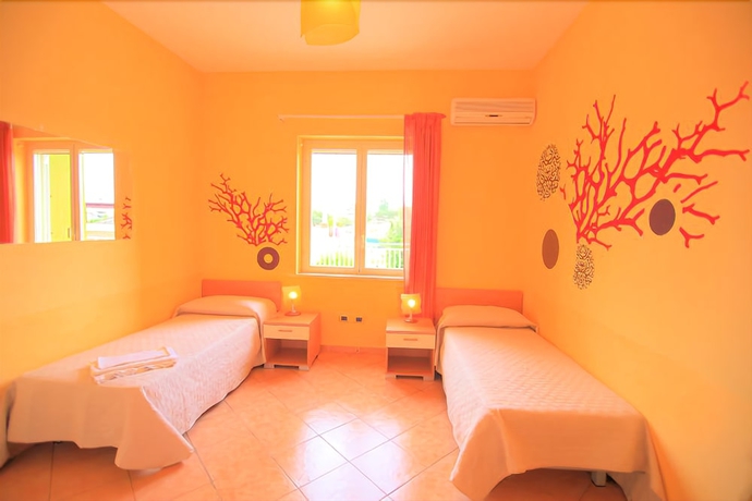 Imagen de la habitación del Hotel Villa Corallina. Foto 9