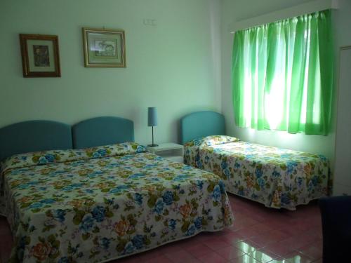 Imagen de la habitación del Hotel Villa Degli Aranci. Foto 10