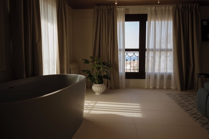 Imagen de la habitación del Hotel Villa Dei Melograni Boutique. Foto 11