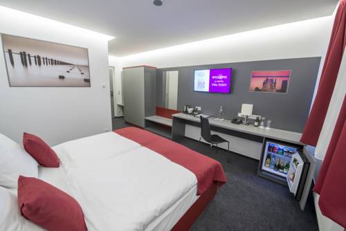 Imagen de la habitación del Hotel Villa Eden. Foto 5