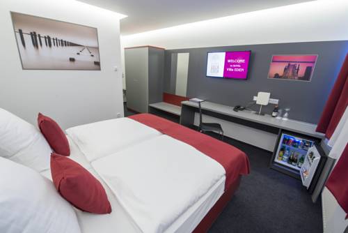 Imagen de la habitación del Hotel Villa Eden. Foto 9