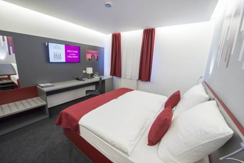 Imagen de la habitación del Hotel Villa Eden. Foto 13