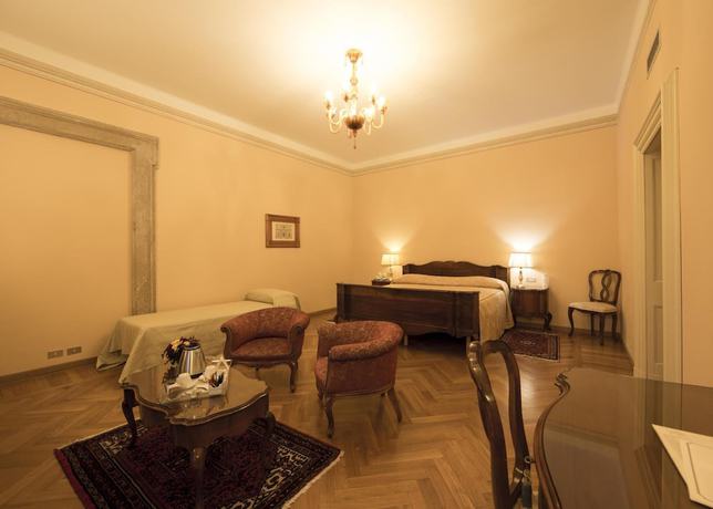 Imagen de la habitación del Hotel Villa Fenaroli Palace. Foto 16