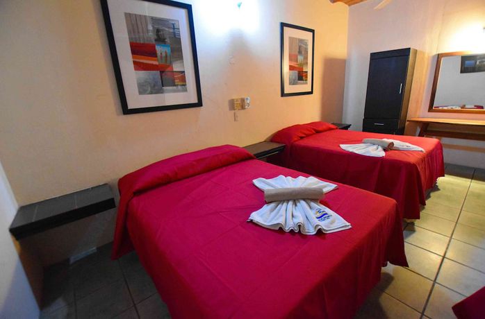 Imagen de la habitación del Hotel Villa Flores. Foto 14