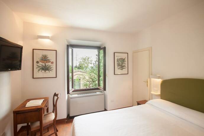 Imagen de la habitación del Hotel Villa I Barronci Resort and Spa. Foto 12