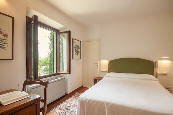 Imagen de la habitación del Hotel Villa I Barronci Resort and Spa. Foto 17