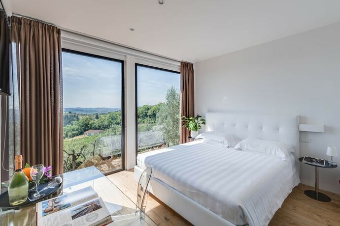 Imagen de la habitación del Hotel Villa I Barronci Resort and Spa. Foto 19