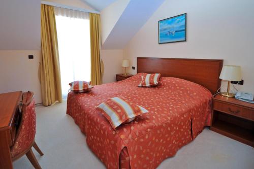 Imagen de la habitación del Hotel Villa Kastel. Foto 7