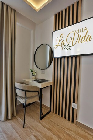 Imagen de la habitación del Hotel Villa La Vida. Foto 12
