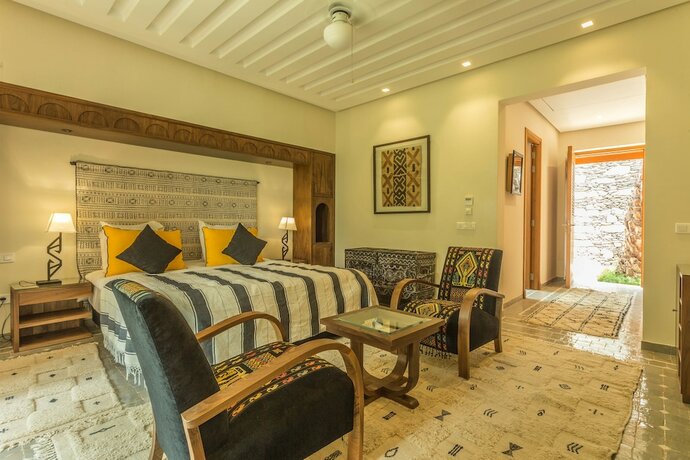 Imagen de la habitación del Hotel Villa Le Perroquet Bleu. Foto 15