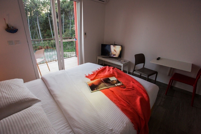 Imagen de la habitación del Hotel Villa Luka's. Foto 18