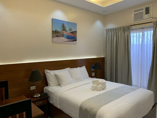 Imagen de la habitación del Hotel Villa MJ Maristela Beach Resort. Foto 17