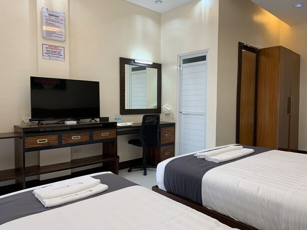 Imagen de la habitación del Hotel Villa MJ Maristela Beach Resort. Foto 28