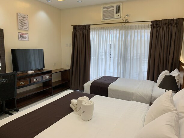 Imagen de la habitación del Hotel Villa MJ Maristela Beach Resort. Foto 30