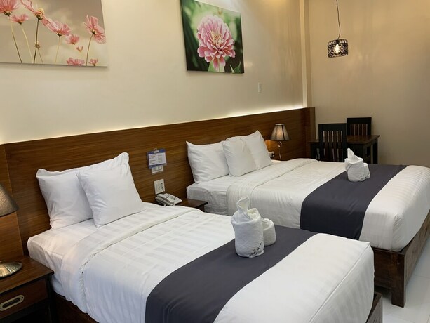 Imagen de la habitación del Hotel Villa MJ Maristela Beach Resort. Foto 34