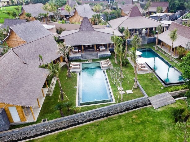 Imagen de la habitación del Hotel Villa Mannao in North Kuta. Foto 19