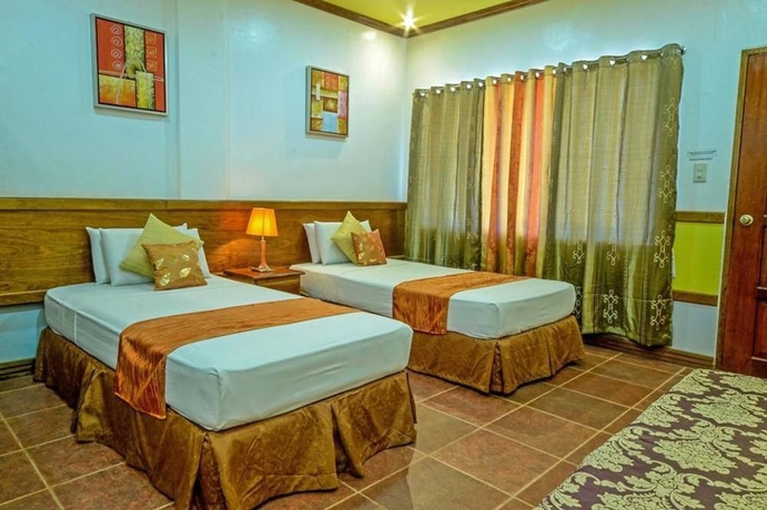 Imagen de la habitación del Hotel Villa Manuel Tourist Inn. Foto 3