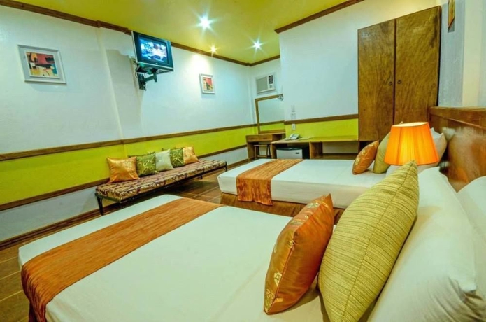 Imagen de la habitación del Hotel Villa Manuel Tourist Inn. Foto 4