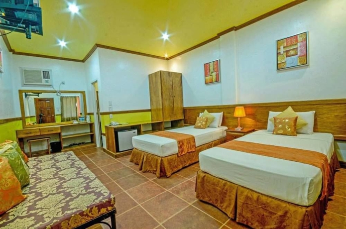 Imagen de la habitación del Hotel Villa Manuel Tourist Inn. Foto 7