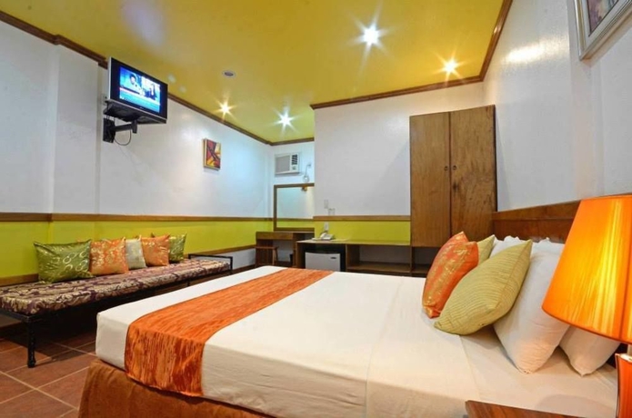 Imagen de la habitación del Hotel Villa Manuel Tourist Inn. Foto 8