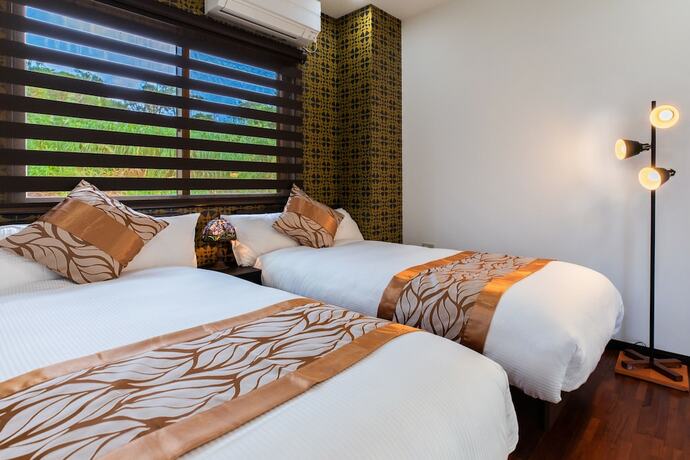 Imagen de la habitación del Hotel Villa Ocean Bridge Kourijima. Foto 22