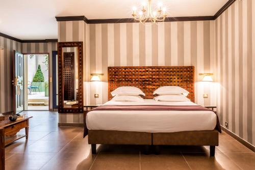 Imagen de la habitación del Hotel Villa Pantheon. Foto 17