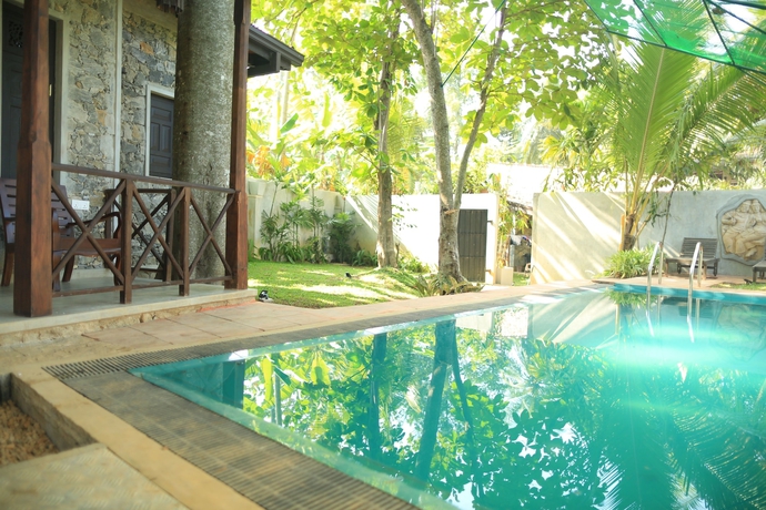 Imagen de la piscina del Hotel Villa Pinnawala And Restaurant. Foto 19