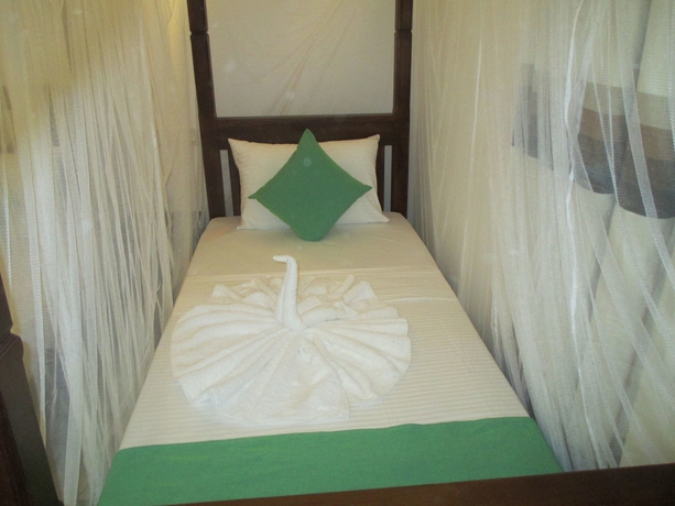 Imagen de la habitación del Hotel Villa Pinnawala And Restaurant. Foto 8