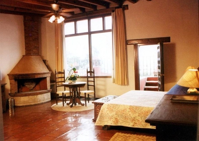 Imagen de la habitación del Hotel Villa San Jose and Suites. Foto 9