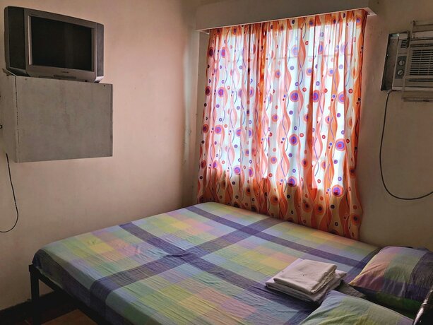 Imagen de la habitación del Hotel Villa Tagumpay Resort. Foto 17