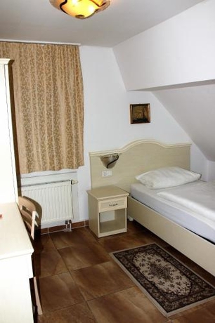 Imagen de la habitación del Hotel Villa Toscana, Gersthofen. Foto 7