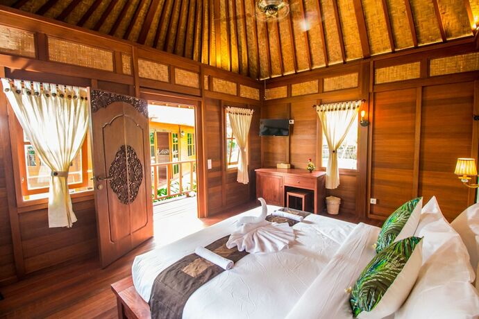 Imagen de la habitación del Hotel Villa Waturenggong Ubud. Foto 23