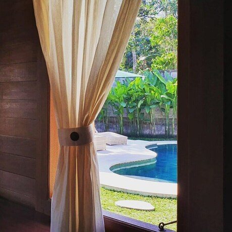 Imagen de la habitación del Hotel Villa Waturenggong Ubud. Foto 31