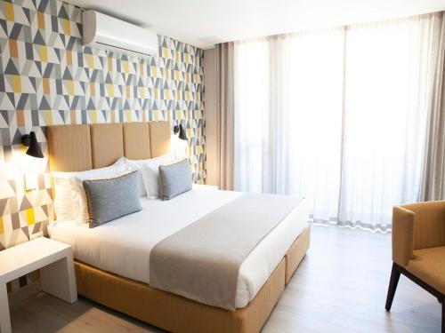 Imagen de la habitación del Hotel Villa Zest Boutique. Foto 8