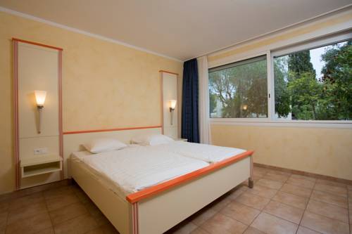 Imagen de la habitación del Hotel Village De Vacances Les Tourelles. Foto 4
