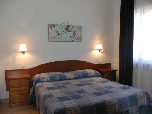 Imagen de la habitación del Hotel Village Lucia. Foto 3
