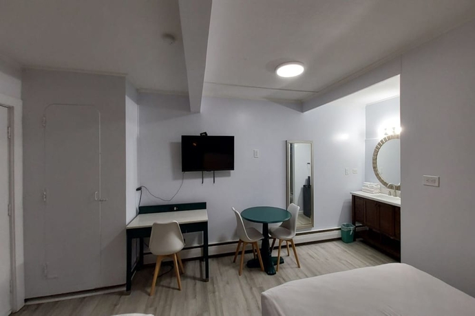 Imagen de la habitación del Hotel Village Motel By OYO Clinton. Foto 12
