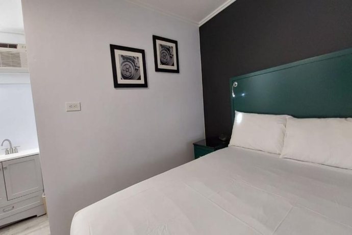 Imagen de la habitación del Hotel Village Motel By OYO Clinton. Foto 16