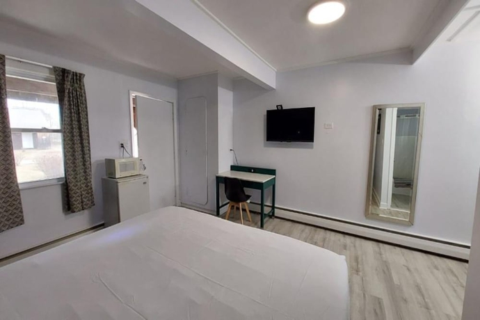 Imagen de la habitación del Hotel Village Motel By OYO Clinton. Foto 18