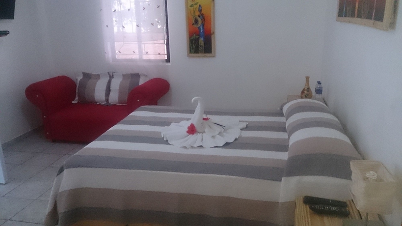 Imagen de la habitación del Hotel Village On The Beach. Foto 4