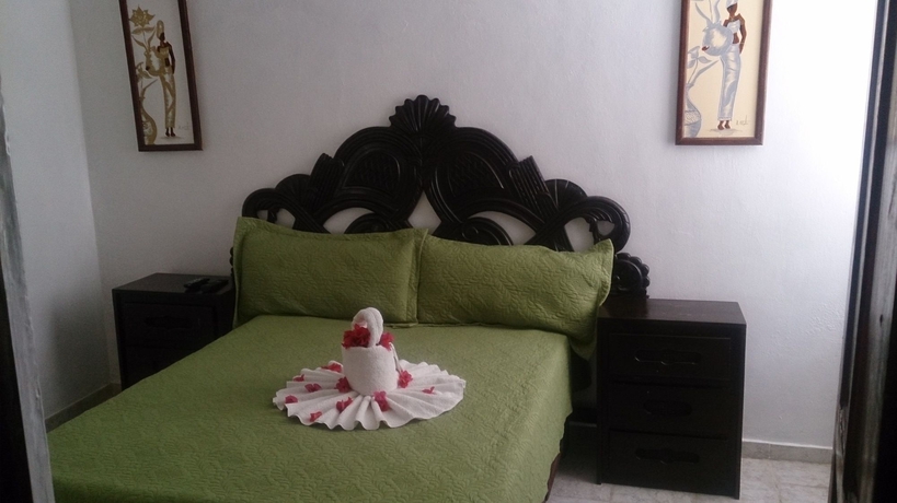Imagen de la habitación del Hotel Village On The Beach. Foto 5