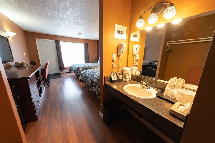 Imagen de la habitación del Hotel Villager Lodge. Foto 5