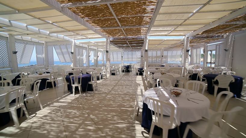 Imagen del bar/restaurante del Hotel Villaggio Approdo Di Ulisse. Foto 3